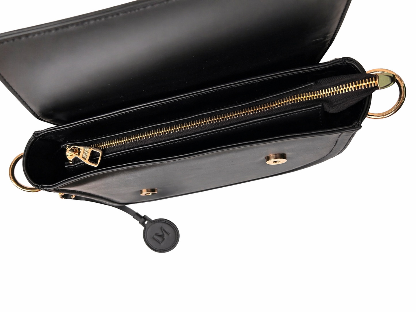 Sac Selle-LM noir en cuir véritable Laure Montigny, design selle d'équitation, bandoulière dorée modulable, détail finitions
